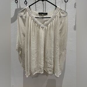 Beautiful sheer with a liner so it’s not see-through size large blouse